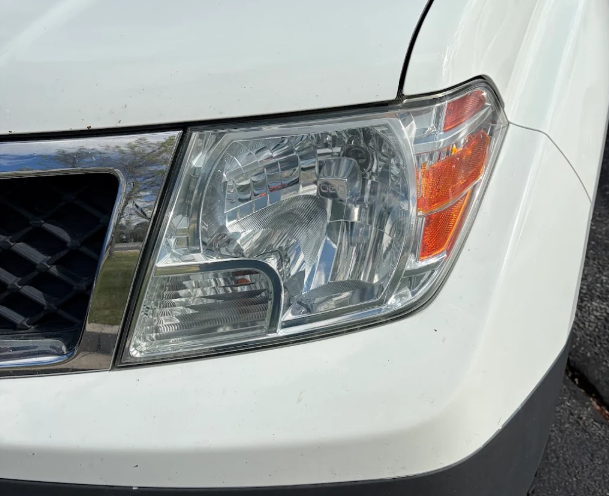 Clear headlight after restoration and ceramic coating — cloudy truck headlight before restoration and the same headlight polished and clear afterward