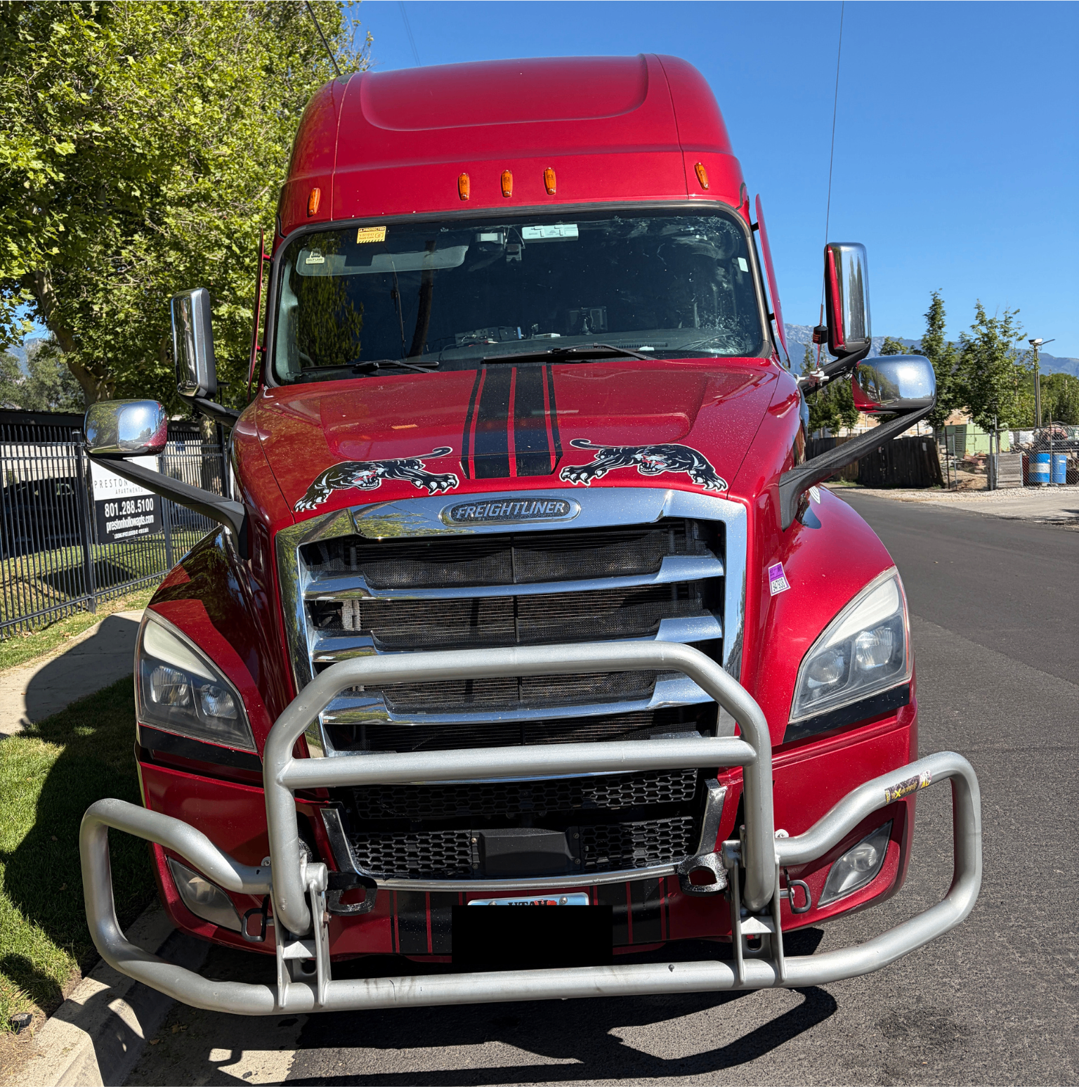 Red Freightliner semi-truck serviced by VP Headlights in Utah