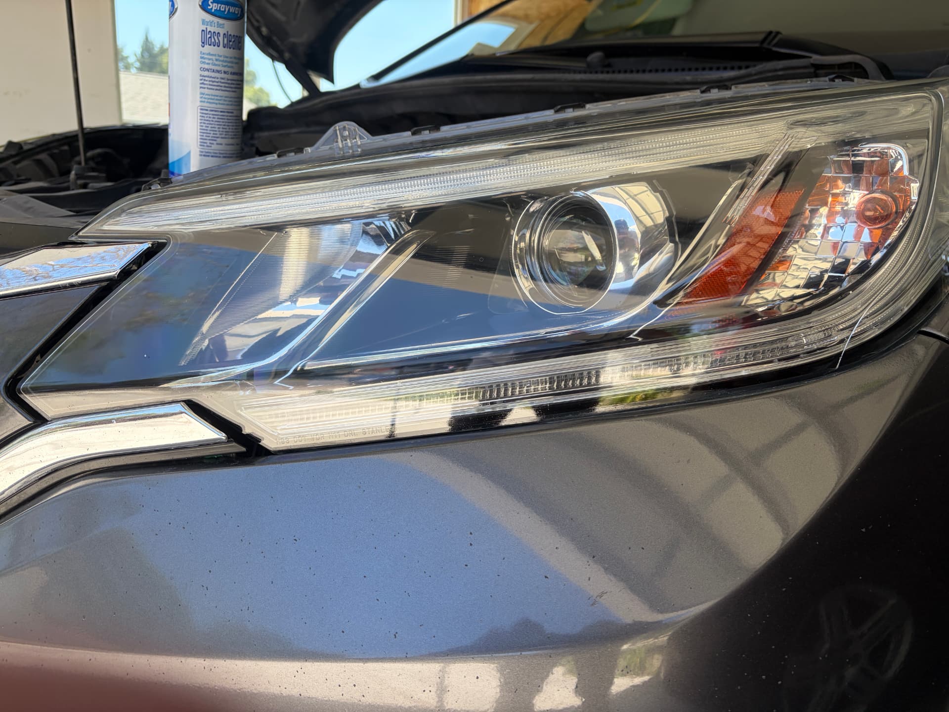 Clear headlight after restoration and ceramic coating — cloudy car headlight before restoration and the same headlight polished and clear afterward