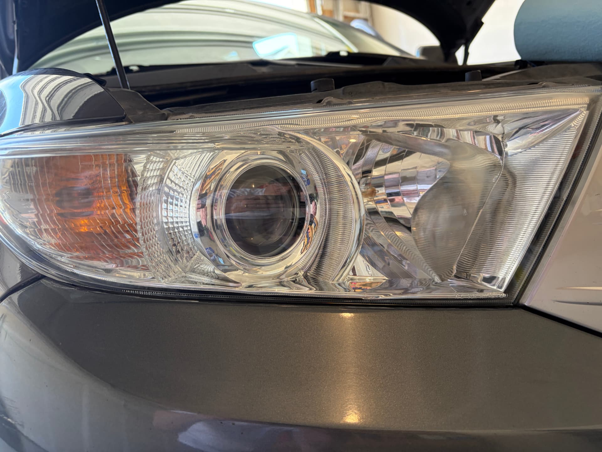Clear headlight after restoration and ceramic coating — Cloudy SUV headlight before restoration