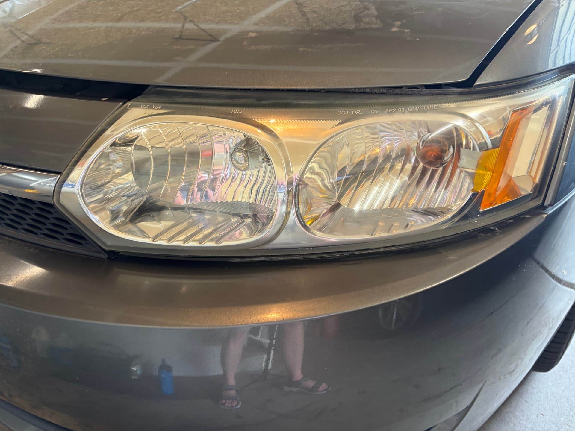 Clear headlight after restoration and ceramic coating — cloudy truck headlight before professional restoration and the same headlight fully restored