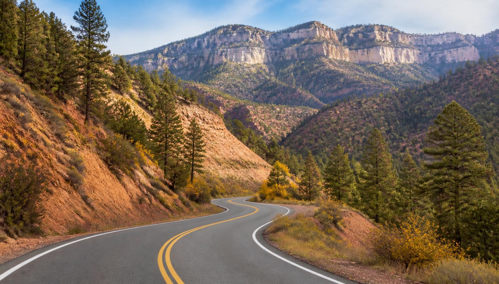 Winding foothill road with mountain ridgeline near Draper, Utah