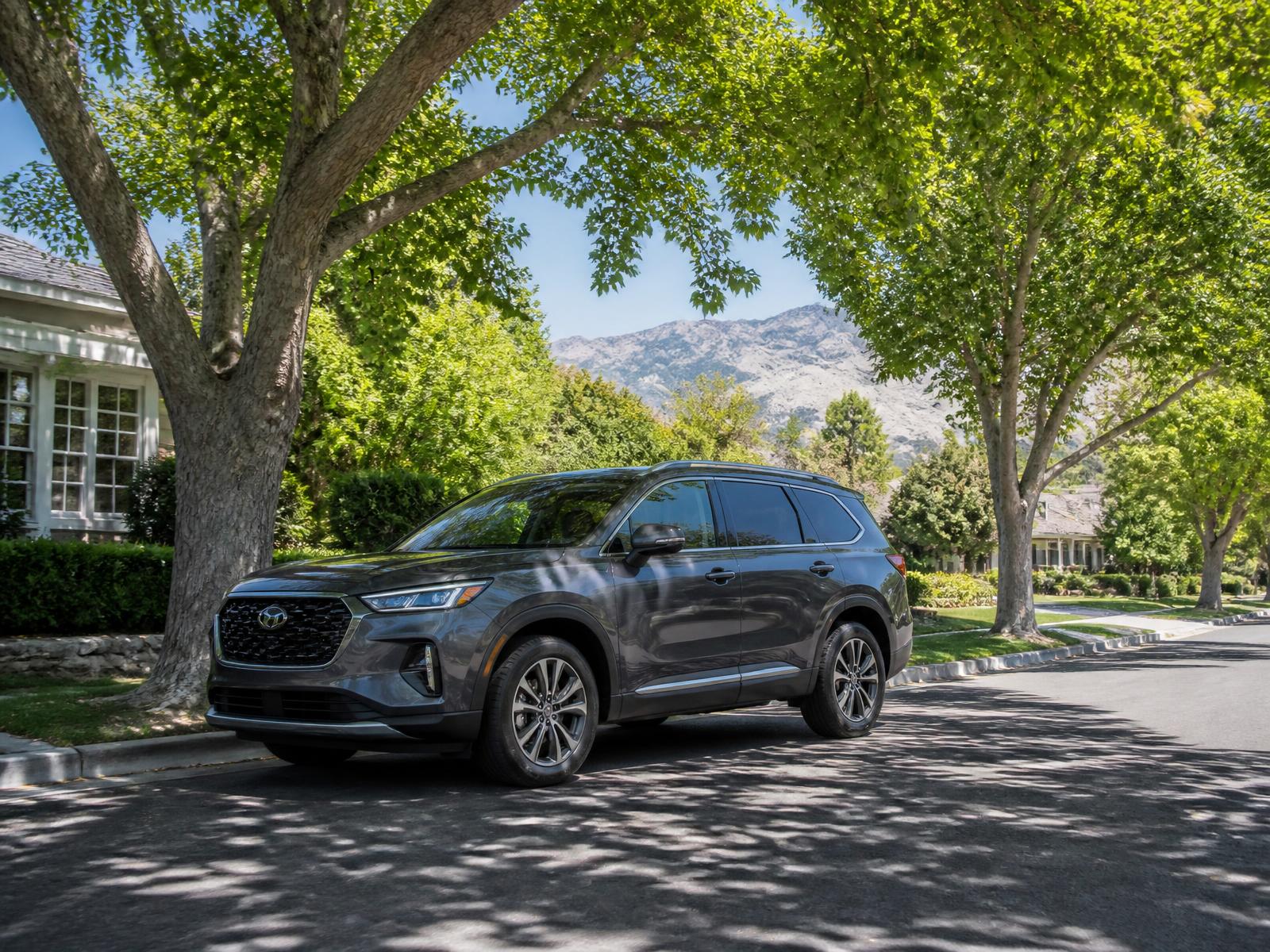 Professional headlight restoration near Canyon Rim — SUV parked beneath mature trees in an established Millcreek neighborhood with foothills in the distance
