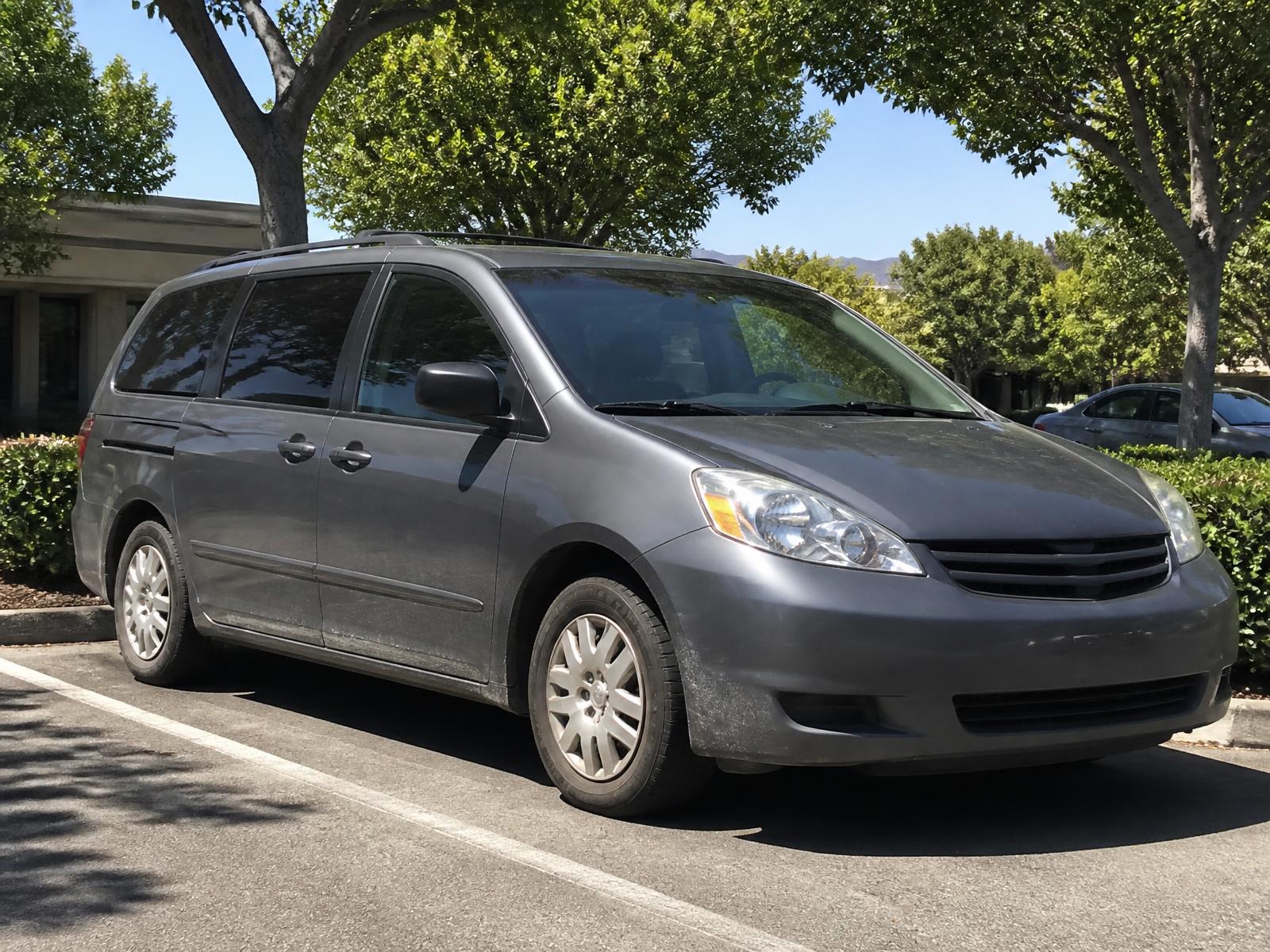 Professional headlight restoration near Redwood Road — family vehicle parked outside in an established Taylorsville neighborhood on a sunny day